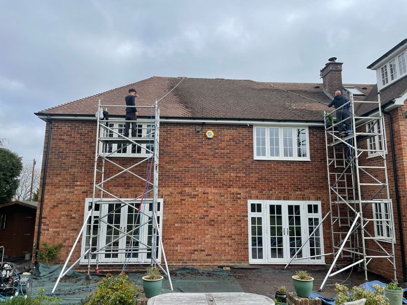 Roof cleaning carried out safely from scaffold towers by The Roof Moss Cleaners in Fareham